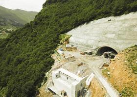 Kazbegi, Georgia - 7th july, 2024 - aerial view cranes and bridge foundation pillars on construction site of new highway road project built by chinese builders.Avalanche bypass tunnel.Tbillisi - Lars photo