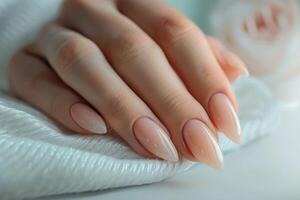 Girl's hands with a beautiful art manicure design nails extension procedure in a beauty salon photo