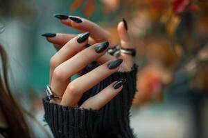 Beautiful hands of a young woman with manicure on nails. Nail care concept photo
