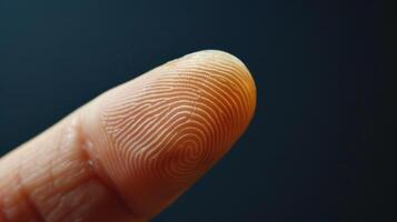 Finger with friction ridges on dark background, macro view photo