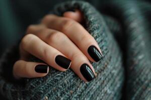 Beautiful hands of a young woman with manicure on nails. Nail care concept photo