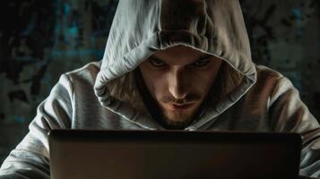 Hacker coding virus ransomware using laptop. Cyber attack, system breaking and malware concept photo
