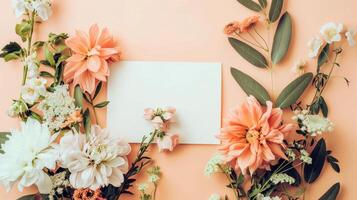 Flat lay of beautiful flowers over orange background and blank card for invitation. Mother's day, Valentine's day or wedding concept. Mock up template with space for text or product. photo