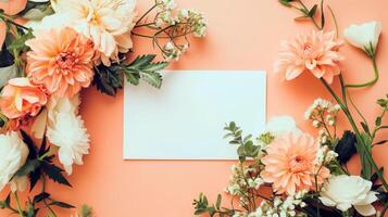 Flat lay of beautiful flowers over orange background and blank card for invitation. Mother's day, Valentine's day or wedding concept. Mock up template with space for text or product. photo