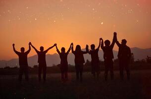 Silhouette of happiness and being free and relaxed in living life, success and working towards planned life goals. photo