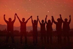 Silhouette of happiness and being free and relaxed in living life, success and working towards planned life goals. photo