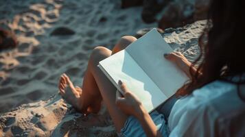 Woman sitting on sandy surface reads open notebook mockup. Beach setting, warm evening light. Outdoor reading book template advertising image. Journal mock up product photorealistic photo