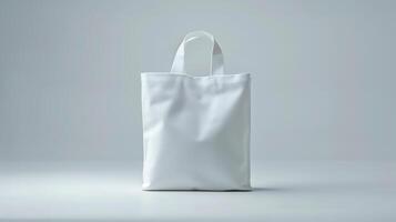 Plain white tote bag mockup stands upright on minimalistic surface. Practicality and versatility. Recycled blank bag template advertising image. Totebag mock up product photorealistic photo