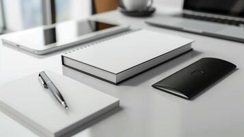 White stationery mockup with gadgets on monochrome desk. Tablet, laptop. Blank spiral notebook template advertising image. Fountain pen, empty notepad mock up product photorealistic photo