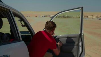 Vlogger filming near Star wars set stage in Sahara sharing his point of view. video