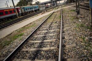 View of train Railway Tracks from the middle during daytime at Kathgodam railway station in India, Train railway track view, Indian Railway junction, Heavy industry photo