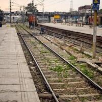 View of train Railway Tracks from the middle during daytime at Kathgodam railway station in India, Train railway track view, Indian Railway junction, Heavy industry photo