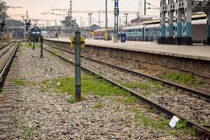 View of train Railway Tracks from the middle during daytime at Kathgodam railway station in India, Train railway track view, Indian Railway junction, Heavy industry photo