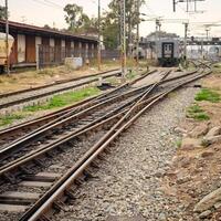 View of train Railway Tracks from the middle during daytime at Kathgodam railway station in India, Train railway track view, Indian Railway junction, Heavy industry photo
