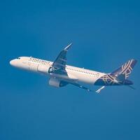 New Delhi, India, June 10 2024 - Vistara Airbus A320 neo take off from Indra Gandhi International Airport Delhi, Vistara domestic aeroplane flying in the blue sky during day time photo