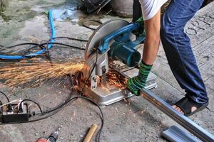 Workers use steel cutters to place various tools. recklessly placed near a water source This can cause a short circuit. Indicates a potentially hazardous situation. photo