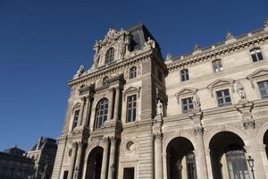 view of the city of light during the day on a blue sky day with its typical architecture photo
