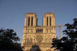 reconstruction of Notre Dame de Paris Cathedral after it caught fire, daytime view photo