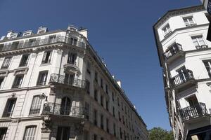 view of the city of light during the day on a blue sky day with its typical architecture photo
