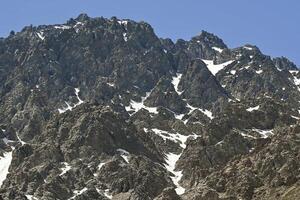 View of mountains in the Andes mountain range near Portillo in summer photo