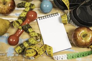 fruit for weight loss with measuring tape and equipment for exercise and diet, weight loss photo