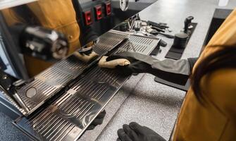 Coffee Shop Cleaning Staff Maintaining Espresso Machine in Modern Cafe Environment photo