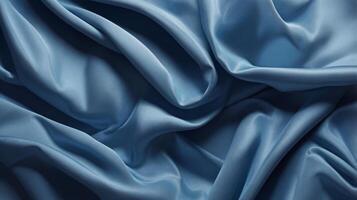 Chambray blue abstract background. Silk satin. Curtain, drapery. Shiny fabric. Wavy soft pleats. photo