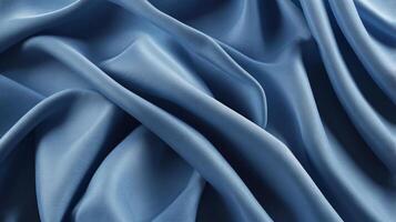 Chambray blue abstract background. Silk satin. Curtain, drapery. Shiny fabric. Wavy soft pleats. photo