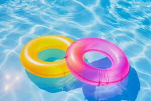 inflatable rings floating on the water in a pool photo