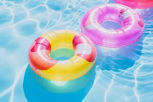 inflatable rings floating on the water in a pool photo