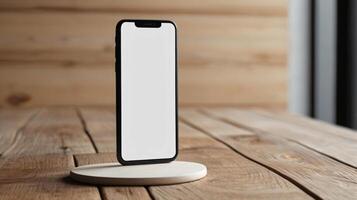 Black mobile smartphone mockup with blank screen isolated on a table, application or design project. photo