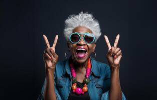 An elderly, modern African American woman with stylish grey hair is captured against a dark background, exuding joy and energy as she gracefully simulates aspects of contemporary senior photo