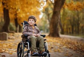 A beautiful young boy in a wheelchair enjoys a serene autumn day, surrounded by vibrant foliage in the park, embracing the wonders of nature with joy and curiosity.Generated image photo