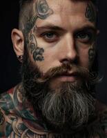 a man with tattoos and a beard photo