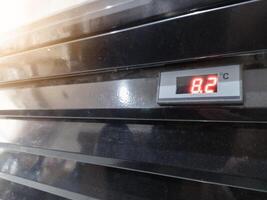 Monitor temperature in the showcase, concept of measuring air temperature in the showcase. photo