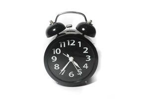 Classic black table clock isolated on a white background. copy space photo