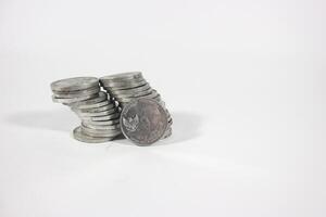 collection of Indonesian rupiah coins on a white background. Stack of Indonesian rupiah coins. Stack of Silver Coins. Financial concept. Copy space. isolated on white photo