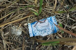 Lampung Indonesia 2nd July 2024 snack packaging that does not decompose in nature for a long time. pollution from plastic photo