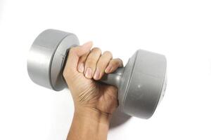 Man's hand holding grey dumbbell isolated on white. photo