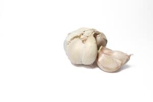 Isolated garlic. Raw garlic with segments isolated on white background photo