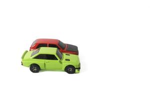 green and red toy cars on isolated white background photo
