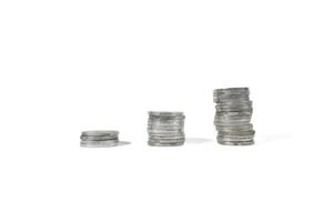 Coin on white background, stacked coins, isolated, sort by level, Indonesian Rupiah. investment and saving concept photo