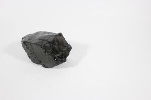 coal on a white background. Isolated on white. Coal can be a fuel that is cheaper than others photo