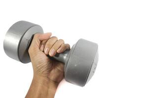 Man's hand holding grey dumbbell isolated on white. photo