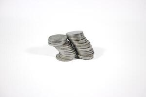 collection of Indonesian rupiah coins on a white background. Stack of Indonesian rupiah coins. Stack of Silver Coins. Financial concept. Copy space. isolated on white photo