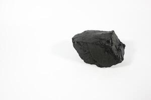 coal on a white background. Isolated on white. Coal can be a fuel that is cheaper than others photo