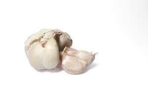 Isolated garlic. Raw garlic with segments isolated on white background photo
