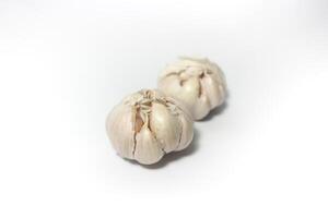 Two Garlic isolated. Raw garlic with segments isolated on white background. photo