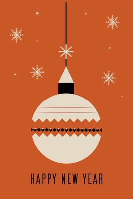 A white ornament hanging from a string with snowflakes in the background
