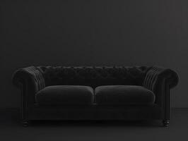 Black chic soft comfortable sofa on a black plain background photo